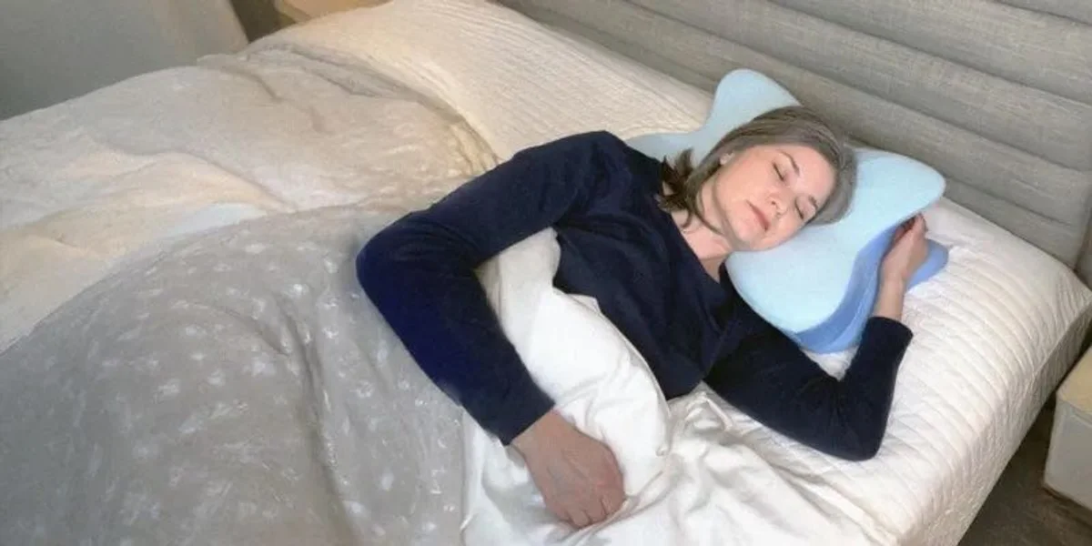 woman sleeping on sleep apnea pillow